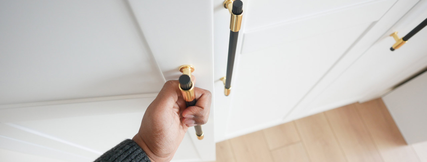 Hand opening bedroom cabinet door stock photo